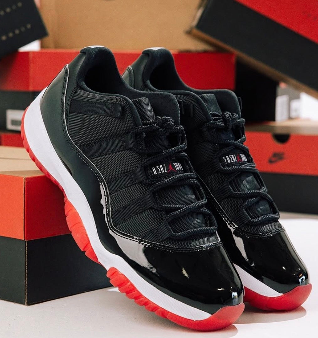 Jordan RETRO 11 LOW NEGRO-ROJO